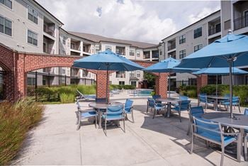 Swimming pool area with shaded chairs